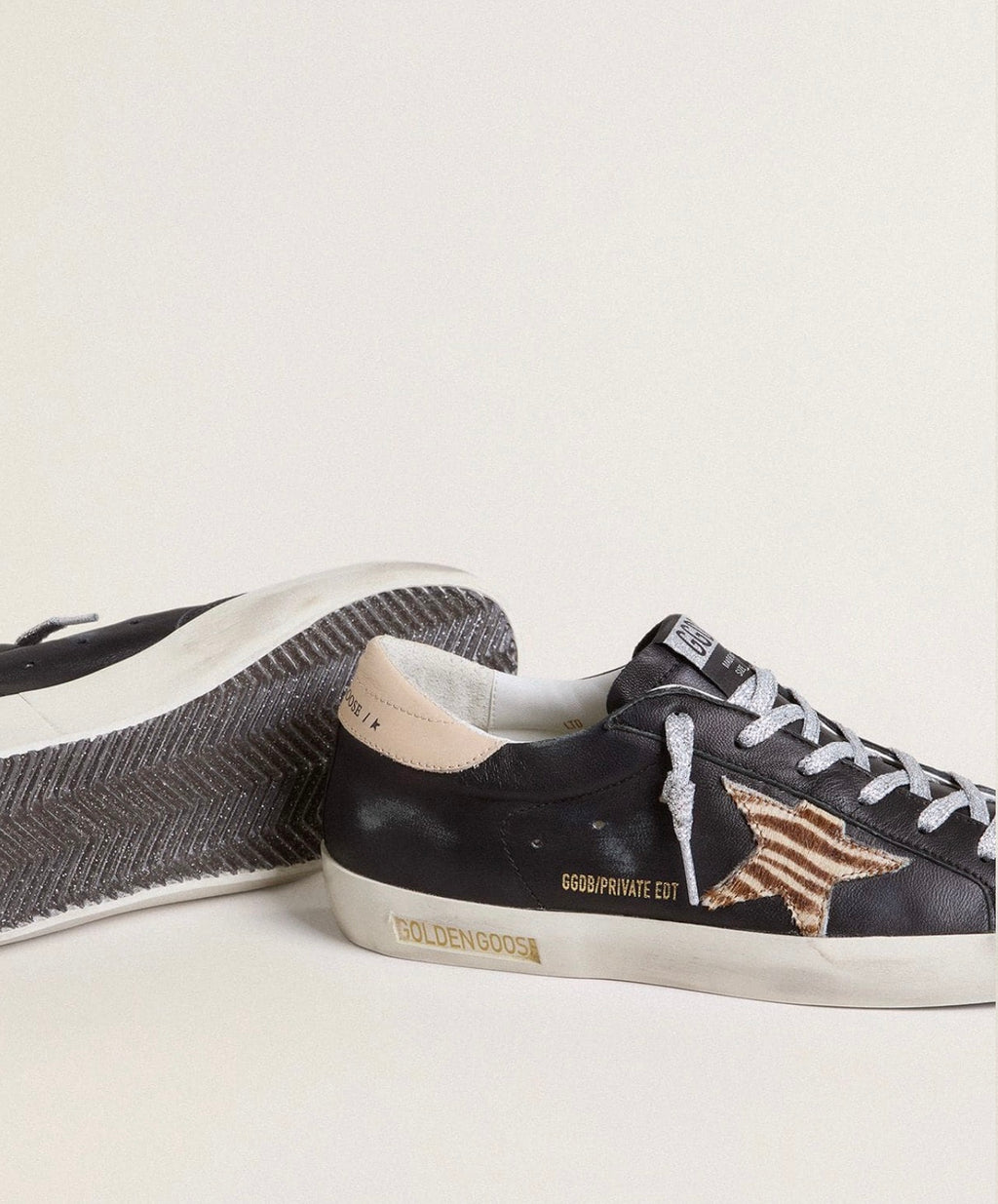 Golden Goose GGDB Women's Super-Star in black nappa leather with zebra-print pony skin star and beige heel tab